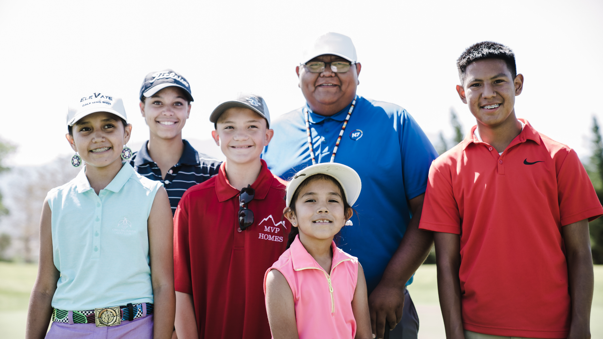 YOC member group photo featuring three boys and three girls in different shirt colors and hats
