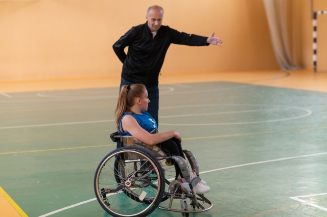 Wheelchair basketball coach and athlete