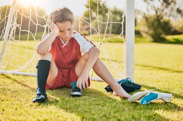 Sports, football loss and child sad over fitness game defeat