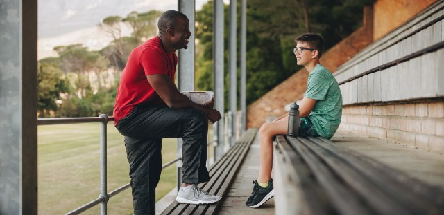 coach and athlete interacting