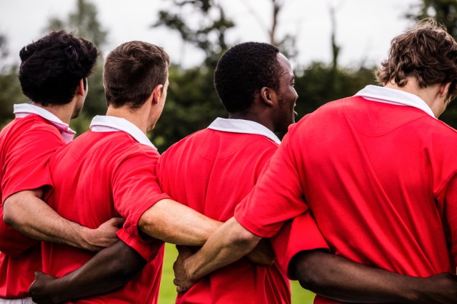 Rugby players standing together before match at the park