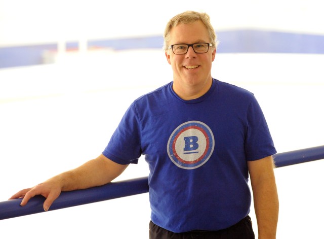 Charlie Poey in front of rink