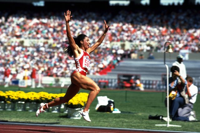 Florence Griffith Joyner of the USA celebrates her 100m win during the 1988 Olympic Games in Seoul, Korea