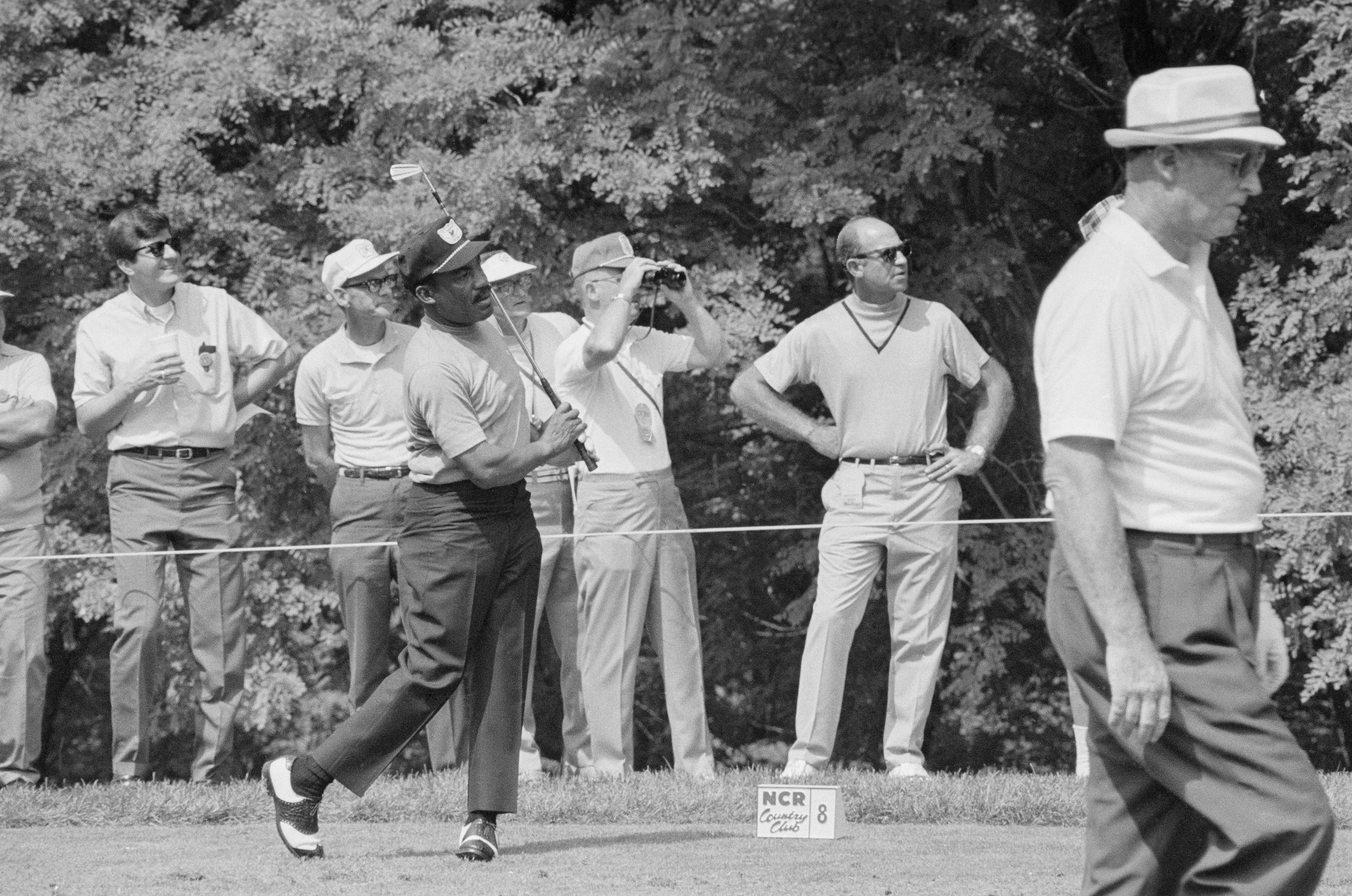 Charlie Sifford after swinging his golf club during game