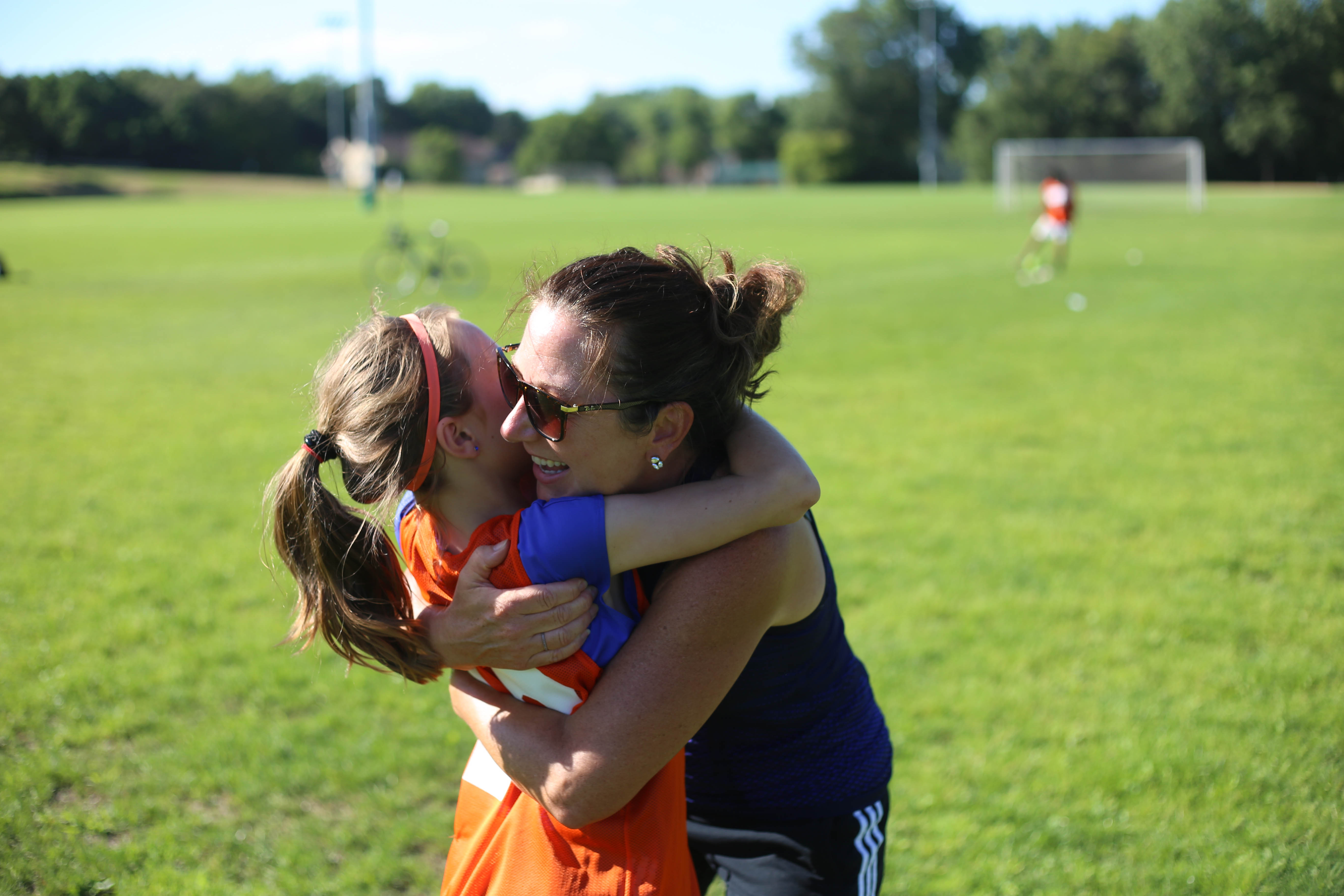 mom hugging girl