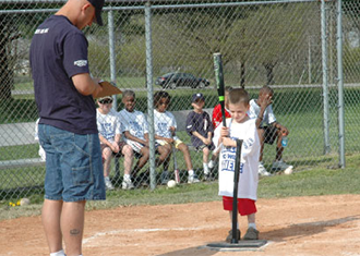 Kid At Tee Coach With Clipboard