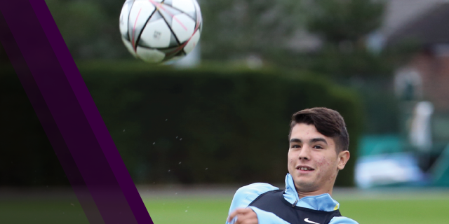 Boy kicking soccer ball