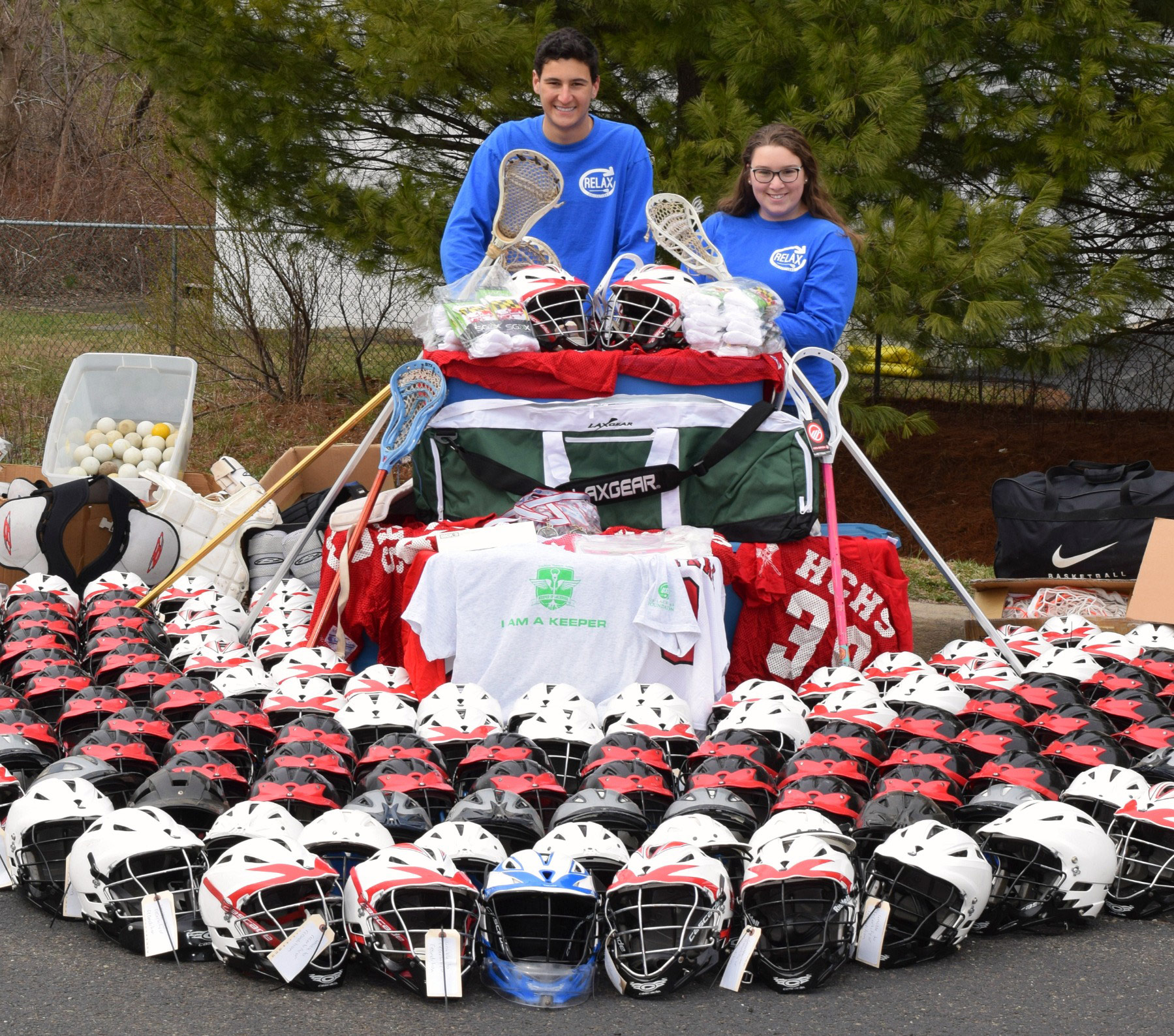 Will Dadouris, left, and Kaitlyn Sleyster find and donate used lacrosse gear as part of their work for ReLax Collections, a non-profit organization founded by Dadouris.