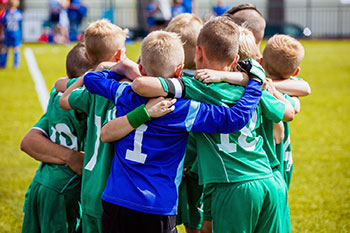 Kids huddle in soccer game