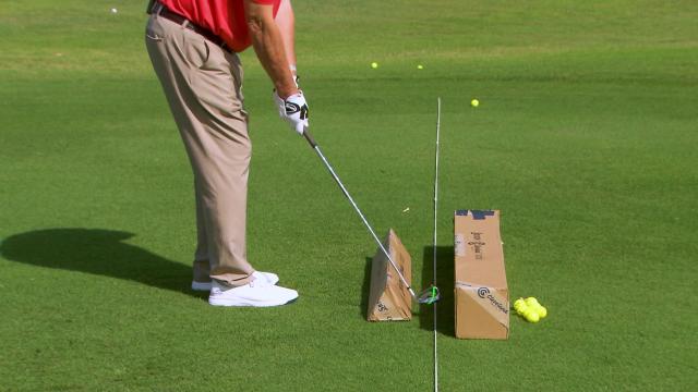 Martin Hall demonstrates a mini swing on the golf course