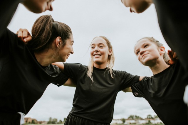 Women players gathering before a match