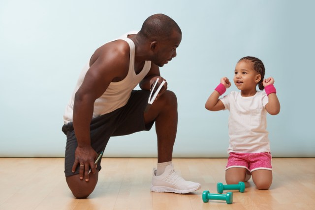 young father fitness training his daughter