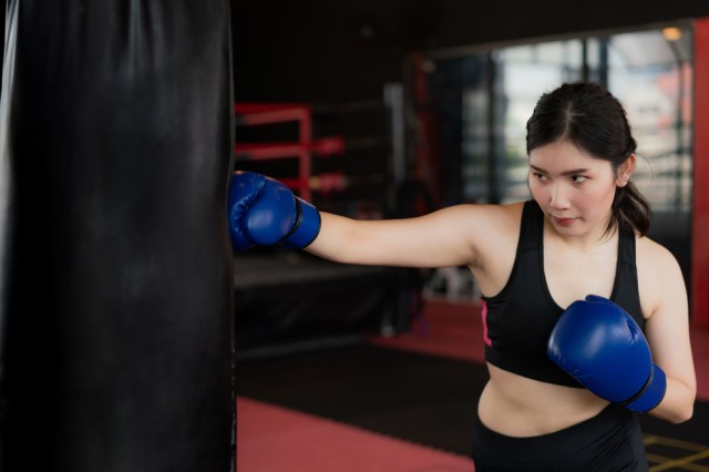 Portrait of Asian confident young boxer woman