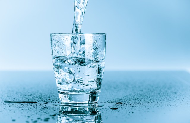 water to drink poured into a glass
