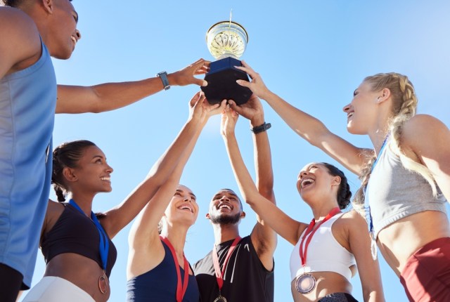 Sports team celebrating winning.