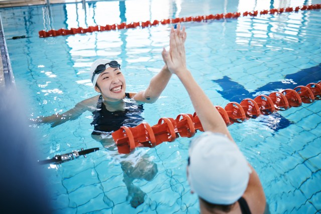Girls high five after race