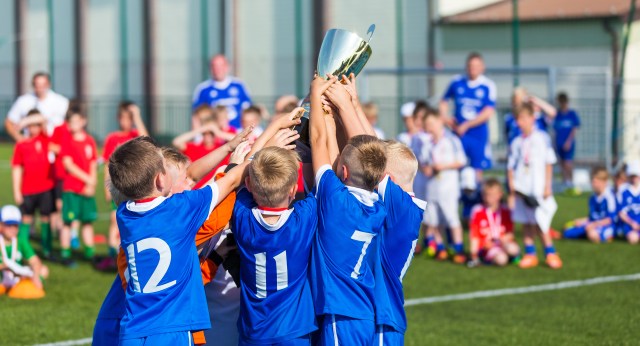 team holding trophy