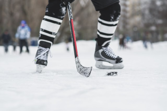 hockey players legs in the moment of attack