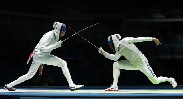 Fencer of Team USA (L) competes against Team Russia fencer in the Men's team foil of the Rio 2016 Olympic Games