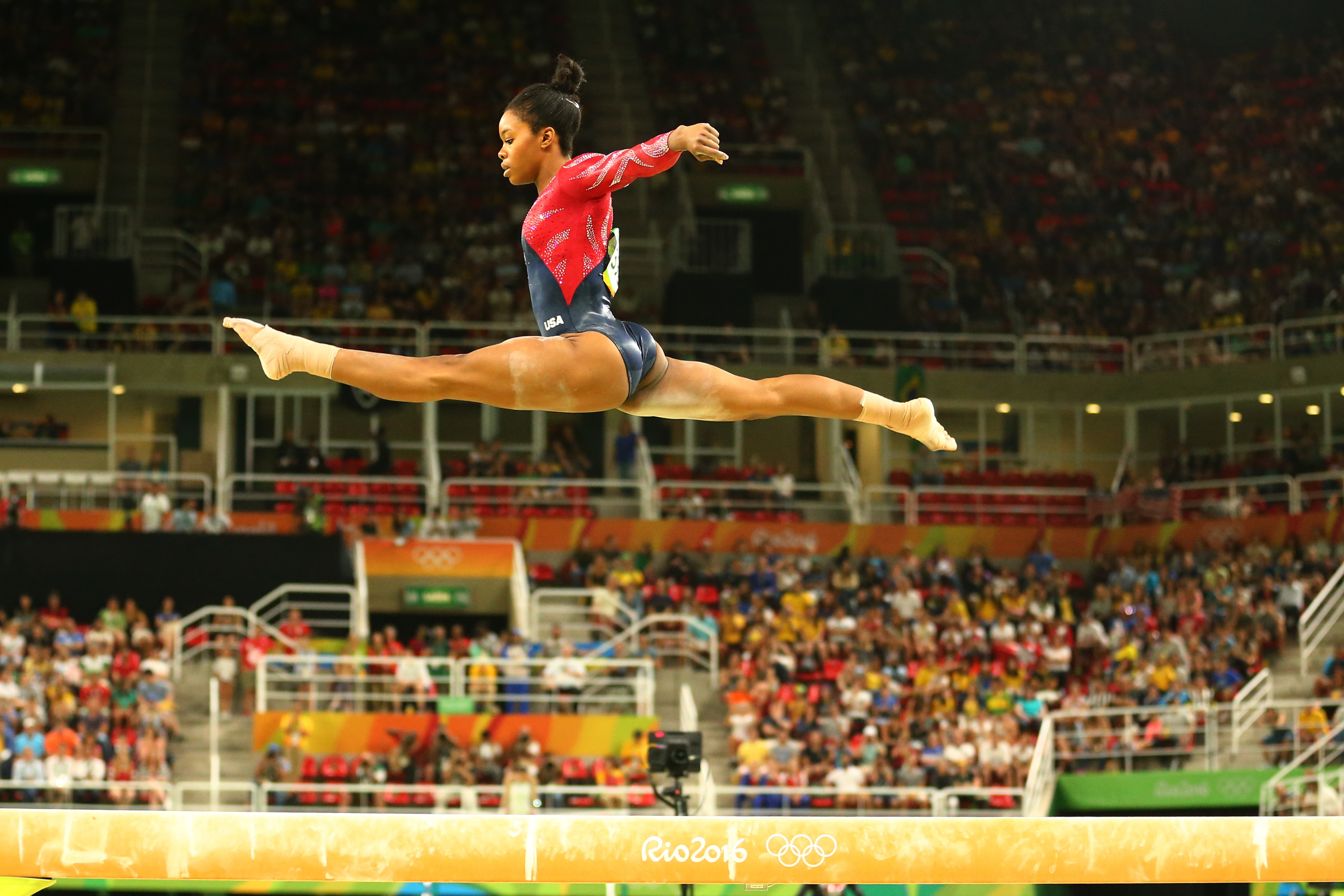 Olympic champion Gabby Douglas of United States competes on the balance beam 