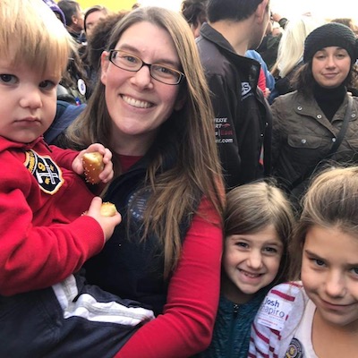 Edie Freudenberger and her children at a walk honoring military members.